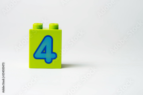 the number four written on the block from the children's constructor