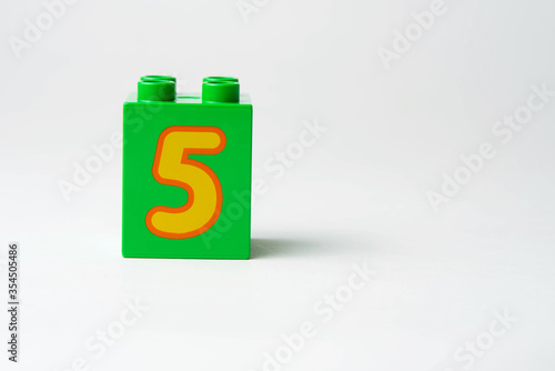 the number five written on the block from the children's constructor