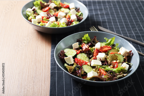 Tasty greek salad with fresh vegetables in a plate.