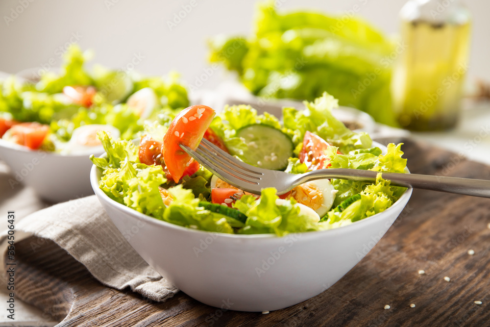 Tasty salad of fresh vegetables with quail eggs. Diet concept Tasty salad of fresh vegetables with quail eggs. Diet concept