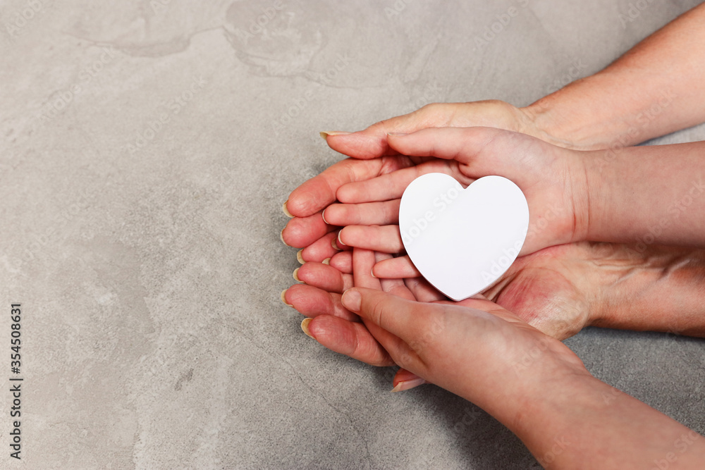 image of old grandmother and a kid holding hands together image of old grandmother and a kid holding hands together