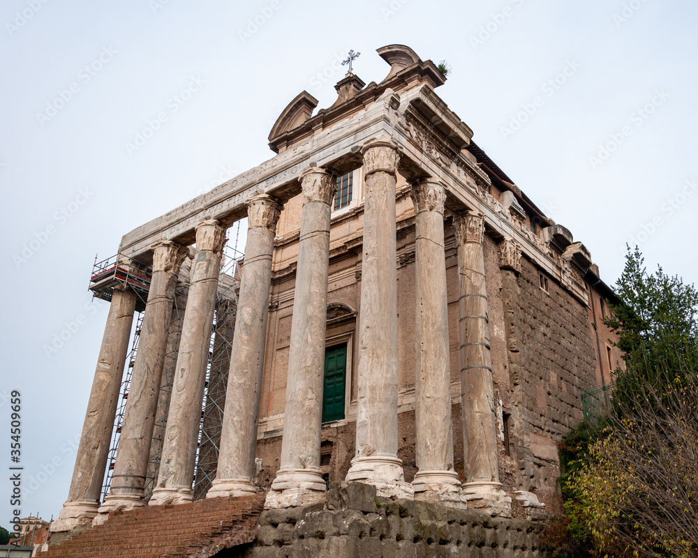Obraz premium Rome Italy. Eternal city famous in the world. UNESCO world heritage with many points of archaeological interest. View of the Temple of Antoninus and Faustina in the Roman Forum.