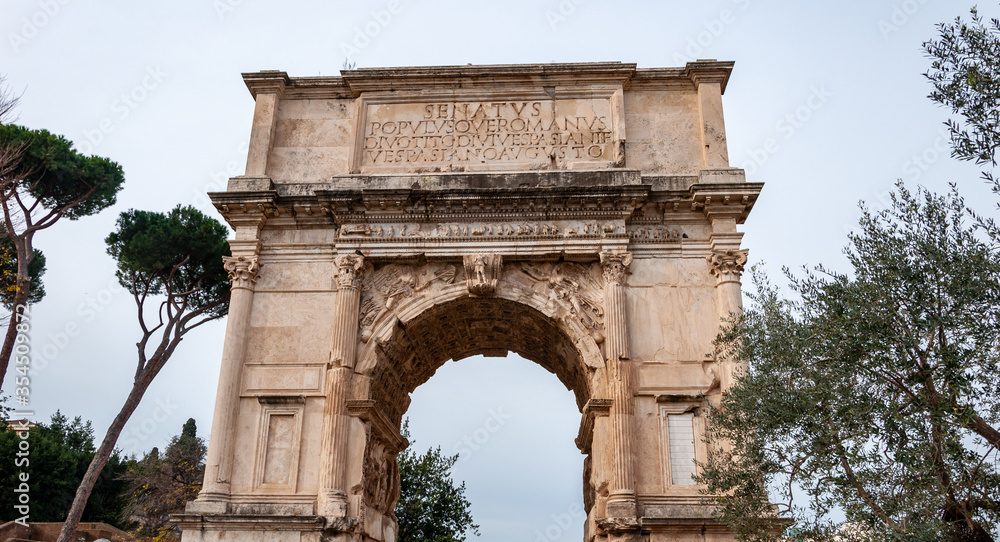 Rome Italy. Eternal city famous in the world. The historic center is on the UNESCO World Heritage List with many points of archaeological interest. View of the Arch of Titus in the Roman Forum. Rome Italy. Eternal city famous in the world. The historic center is on the UNESCO World Heritage List with many points of archaeological interest. View of the Arch of Titus in the Roman Forum.