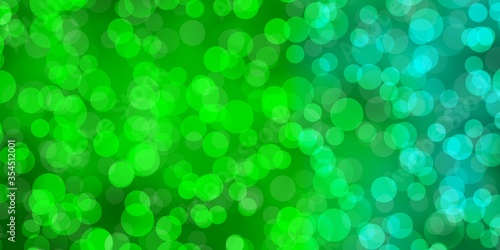 Light Green vector texture with disks. Abstract decorative design in gradient style with bubbles. Pattern for business ads.