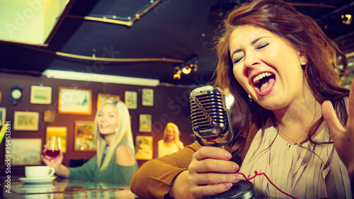Woman singing with microphone