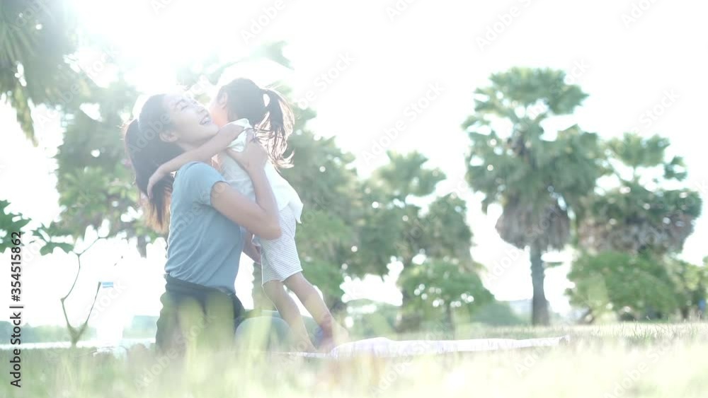 Mother and daughter run happily together in the park. Mother and daughter run happily together in the park.