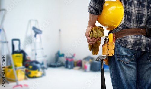 Photography repair, construction and building - male worker or builder with helmet and worki