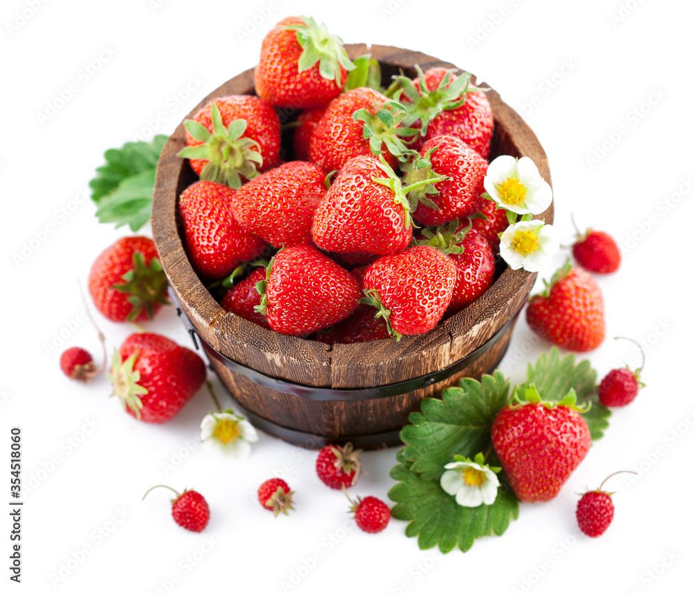 Fresh strawberry in wooden bucket with green leaf and flower. Isolated on white background. Fresh strawberry in wooden bucket with green leaf and flower. Isolated on white background.