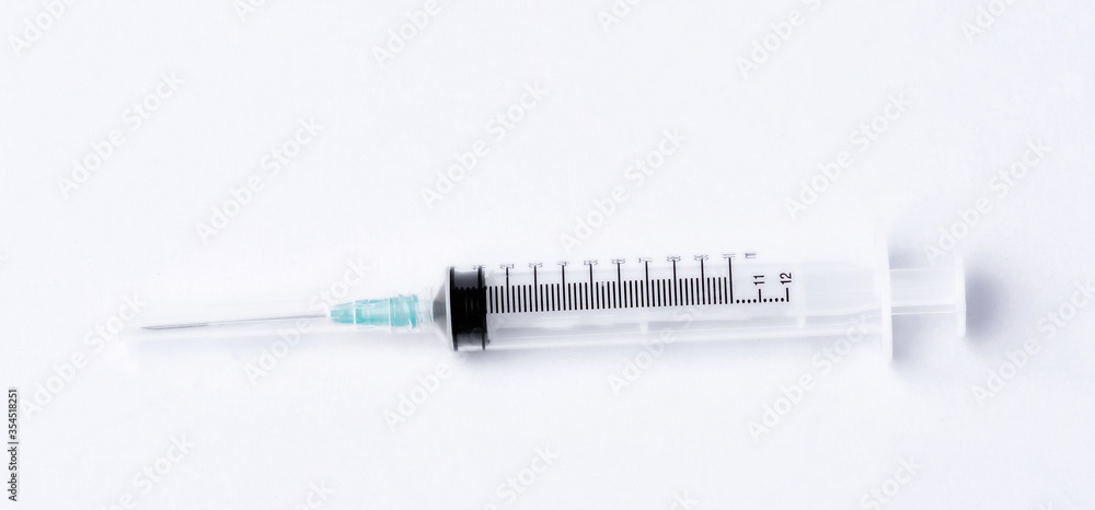 Empty syringe closeup on white background. Empty syringe closeup on white background.