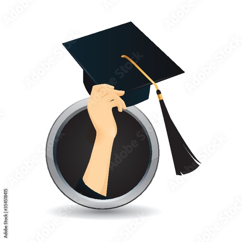 Hand holding graduation cap