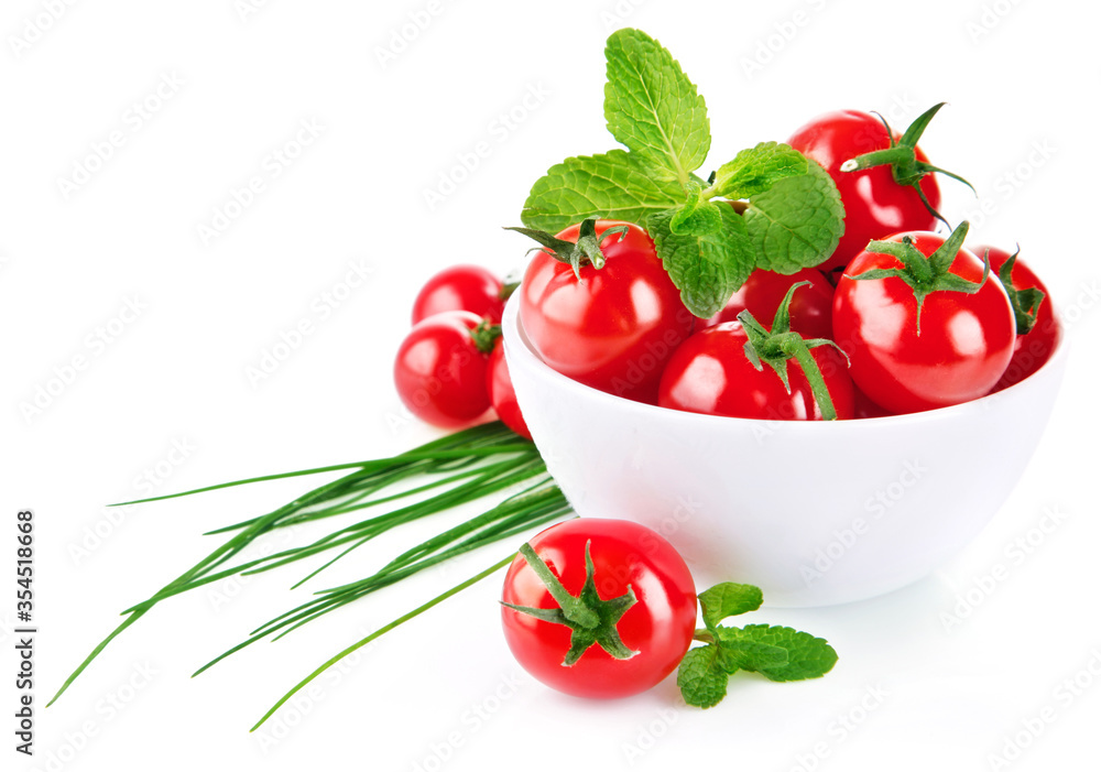 Fresh tomato in plate with green leaf. Isolated on white background. Fresh tomato in plate with green leaf. Isolated on white background.