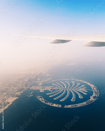 Photography Aerial view of Palm Jumeirah islands in Dubai from the airplane window seat