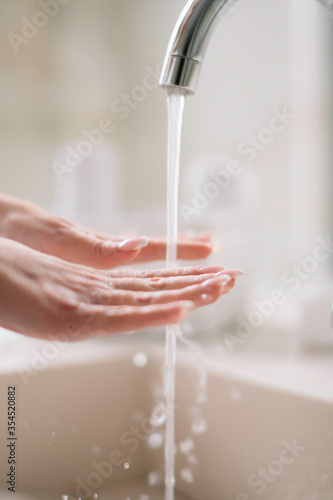 Close up of woman wash her hands. 