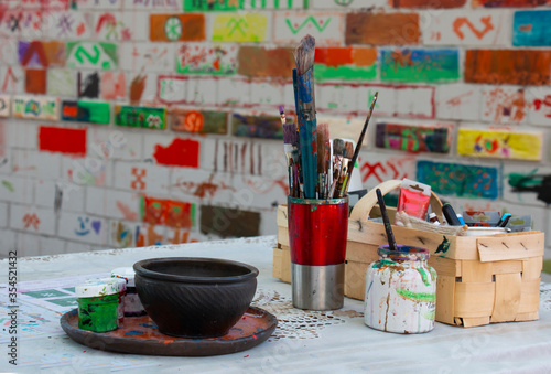 artist's tassels in a mug on the table