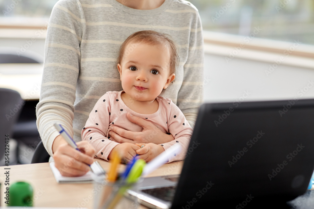remote job, multi-tasking and family concept - mother with baby working at home office remote job, multi-tasking and family concept - mother with baby working at home office