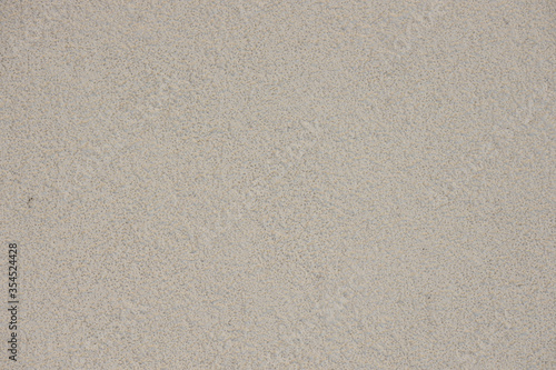 Foto Abstract of white grainy wall from decorative pargeting material plaster, close-up