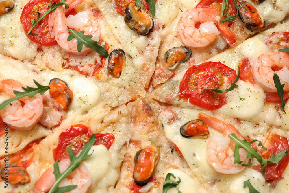 Delicious seafood pizza as background, closeup view
