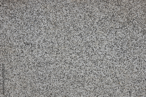Close up a lot of small or tiny stones that are mixed with cement. The surface of concrete wall, flooring texture and background for web design and architect.