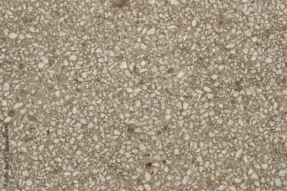 Close up a lot of small or tiny stones that are mixed with cement. The surface of concrete wall, flooring texture and background for web design and architect. Close up a lot of small or tiny stones that are mixed with cement. The surface of concrete wall, flooring texture and background for web design and architect.