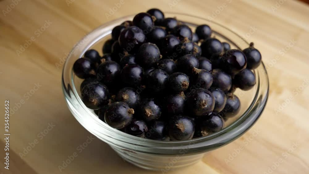 Black currant in a glass plate Black currant in a glass plate