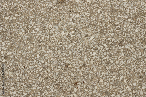 Close up a lot of small or tiny stones that are mixed with cement. The surface of concrete wall, flooring texture and background for web design and architect.