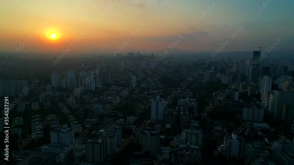Moving ahead with a beautiful sunset Drone in the city of São Paulo during the quarantine period, magic light and many buildings Moving ahead with a beautiful sunset Drone in the city of São Paulo during the quarantine period, magic light and many buildings