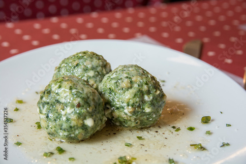 North italian traditional dish: Canederli, boiled dumplings with meat, spinach and cheese