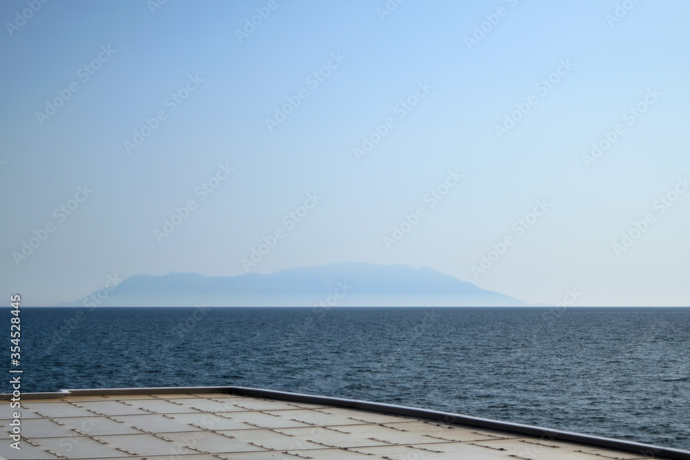 Cloudy Samothraki view from ferry rooftop. Greece, Aegean sea