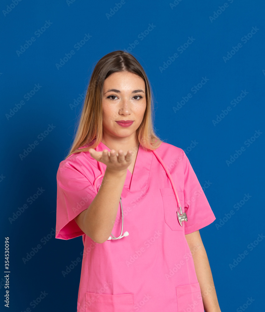 Fototapeta premium Blonde doctor with pink uniform