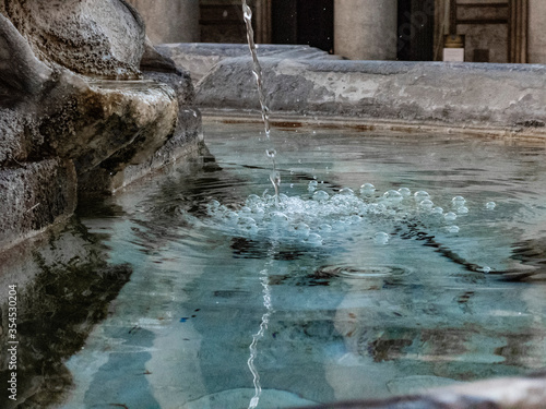 Detail of waterfall in the Fountain of Pantheon in Rome © daniele