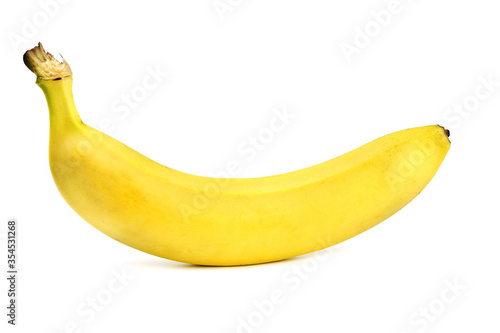 A ripe banana is isolated on a white background