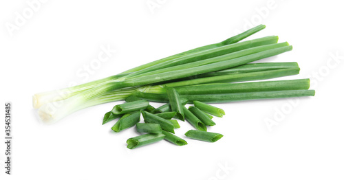 Fresh green spring onions isolated on white