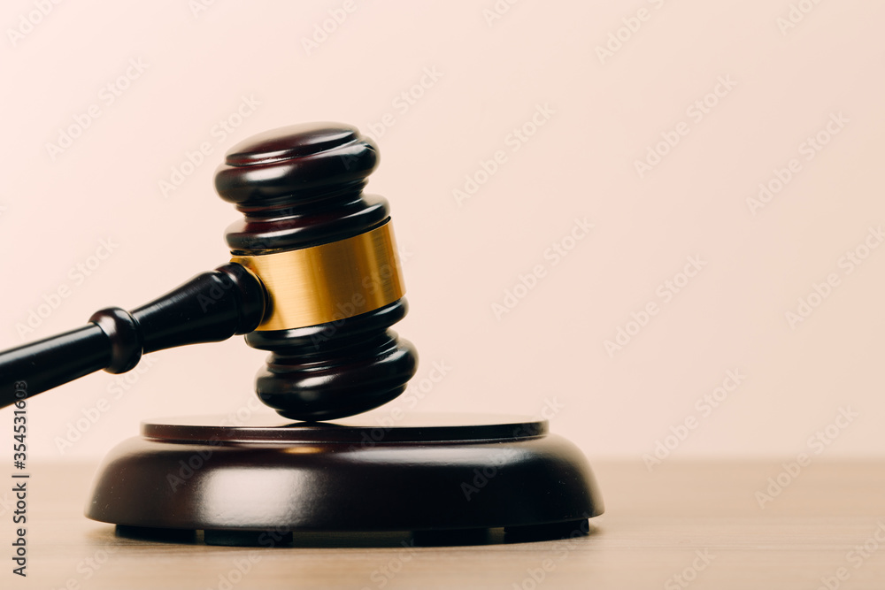 Symbol of law and justice on wooden table in lawyer office Symbol of law and justice on wooden table in lawyer office