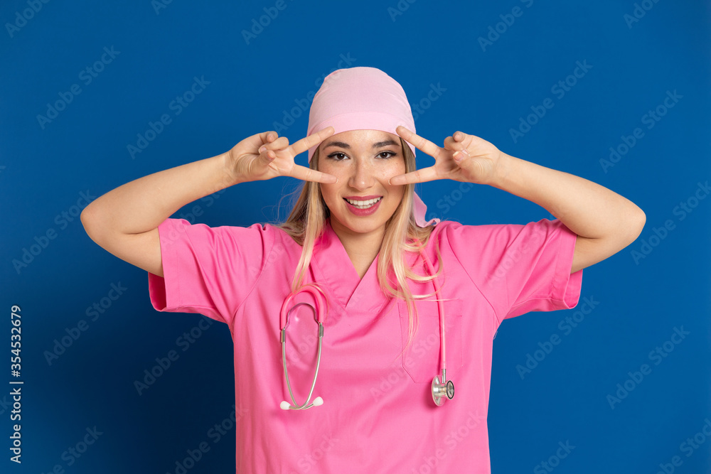 Young doctor with a pink uniform and a scarf Young doctor with a pink uniform and a scarf