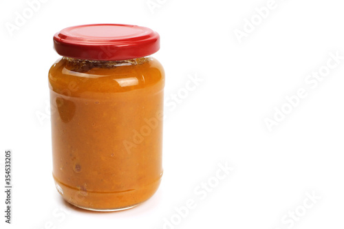 Pumpkin porridge in a glass jar isolated on white, natural, healthy baby food