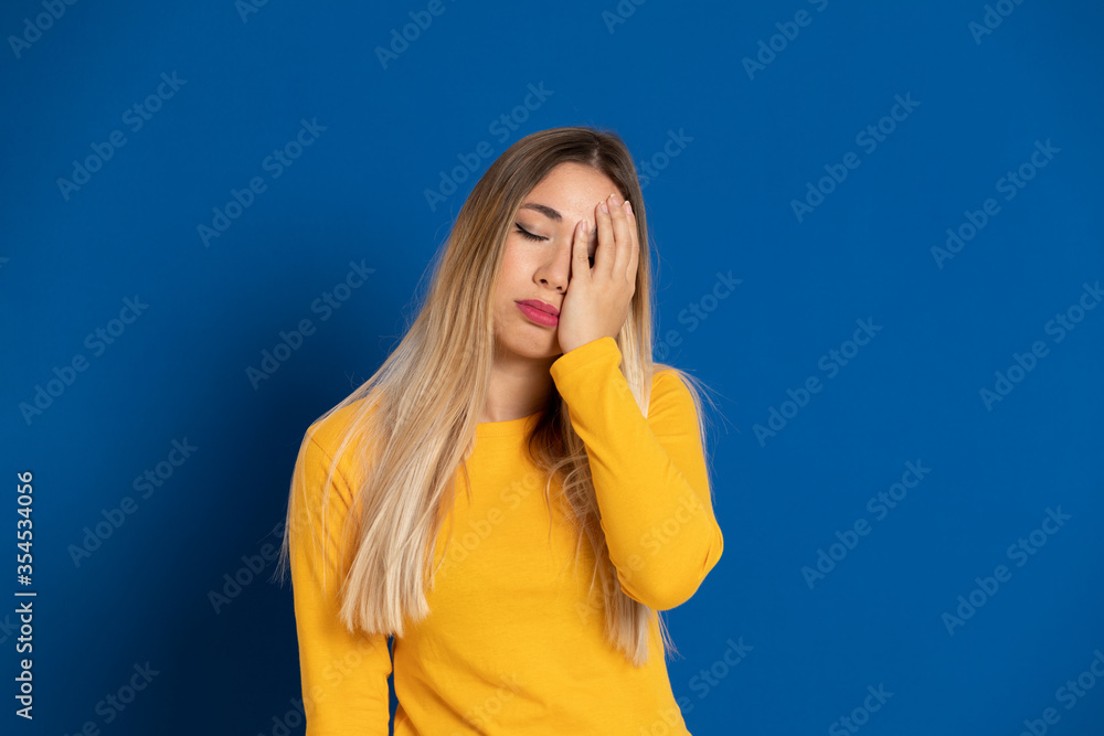 Blonde girl wearing a yellow T-shirt Blonde girl wearing a yellow T-shirt