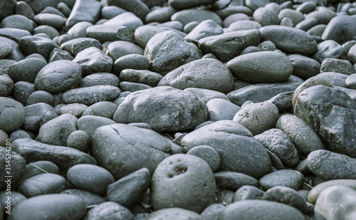 Black pebbles on the beach