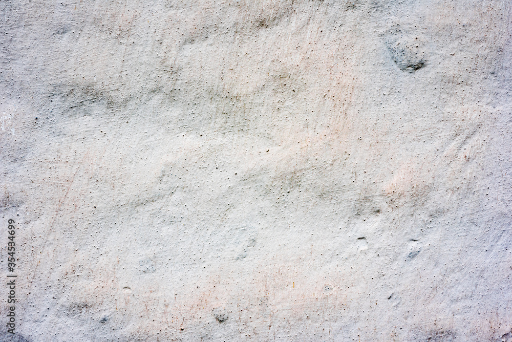 Texture of a concrete wall with cracks and scratches which can be used as a background Texture of a concrete wall with cracks and scratches which can be used as a background
