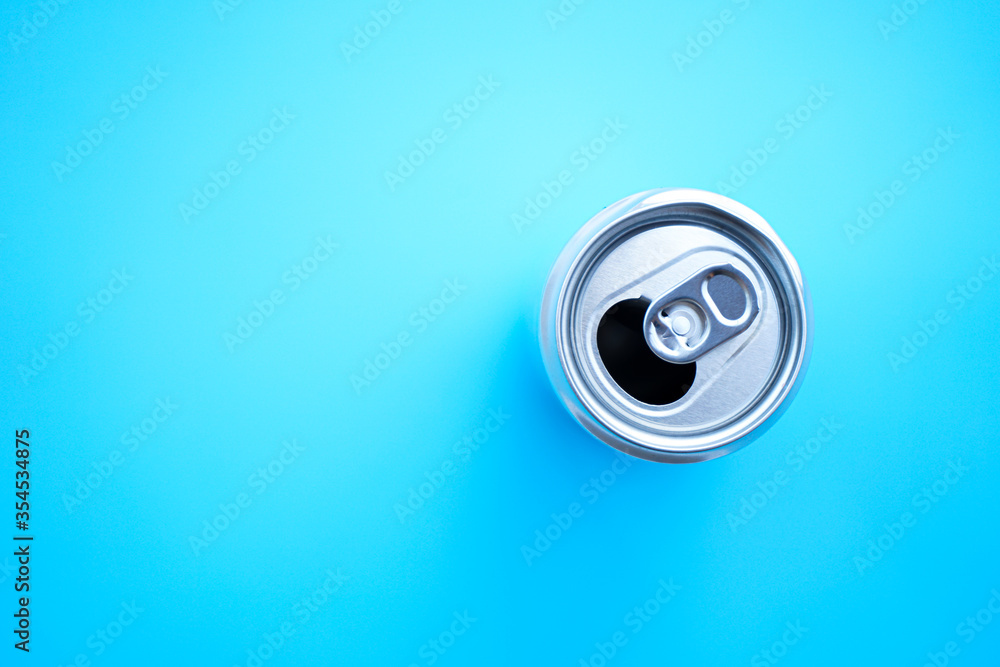 Flat lay of beer can on blue background Flat lay of beer can on blue background