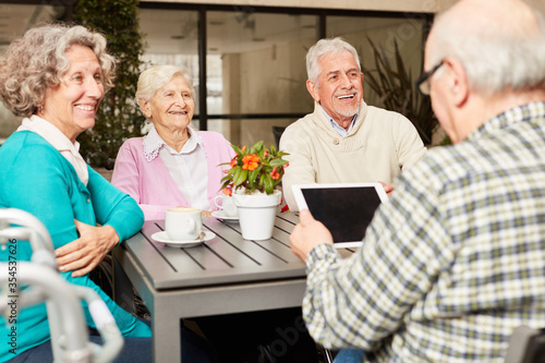 Group of seniors using a Tablet PC