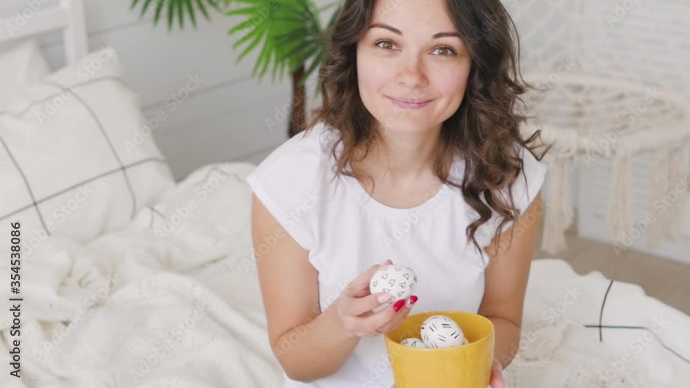 Attractive brunette girl with easter eggs in her hands smiling. Attractive brunette girl with easter eggs in her hands smiling.