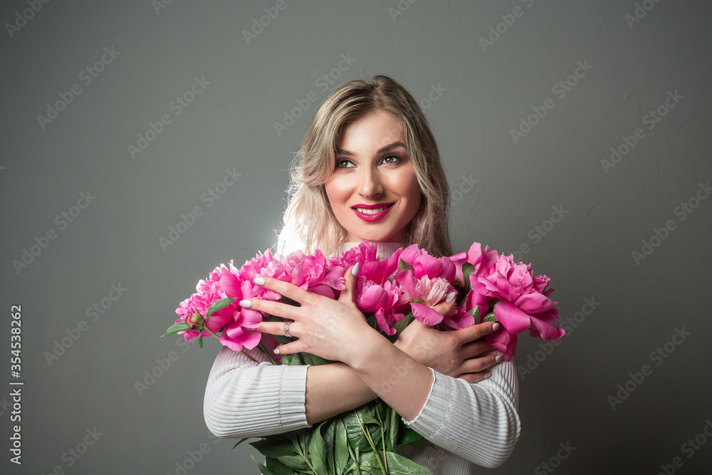 beauty flower girl with pink peonies. beauty, spa and body care concept