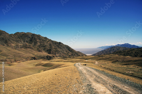 Dirt road among the mountains. Kazakhstan