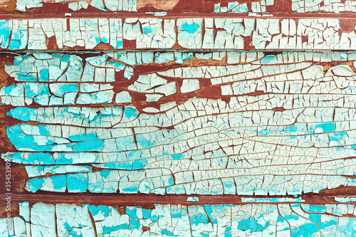 Old cracked paint on a wooden wall