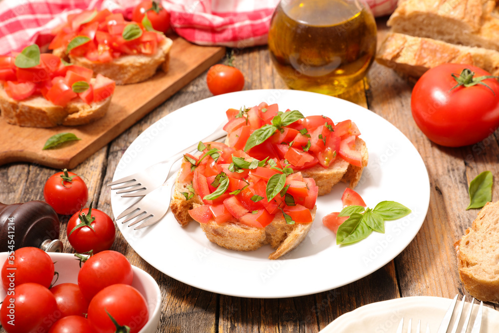 bruschetta- bread slice with tomato, basil and olive oil bruschetta- bread slice with tomato, basil and olive oil