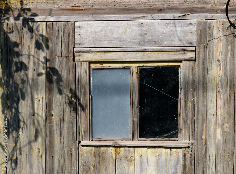 window of an old abandoned house, a farmer's barn.