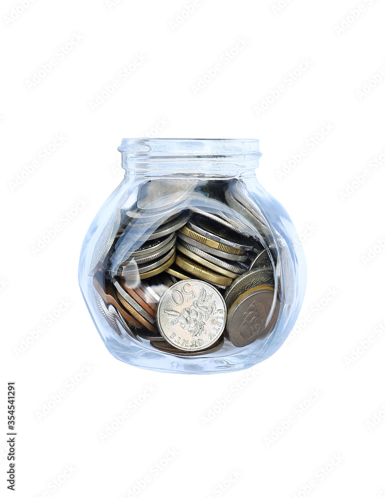 International coins in money glass jar isolated on white background. International coins in money glass jar isolated on white background.
