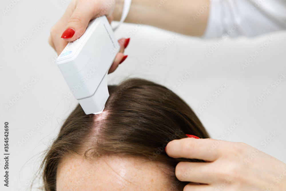 Naklejka premium Hair treatment. Doctor trichologist