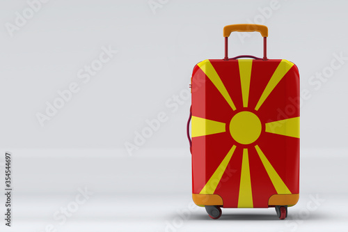 Obraz na plátne Macedonia flag on a stylish suitcases back view on color background