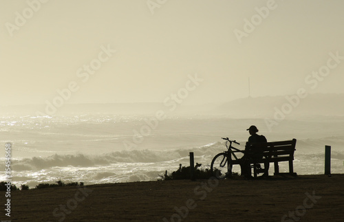 Lonely person watching a misty sea